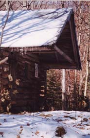 log cabin in snow